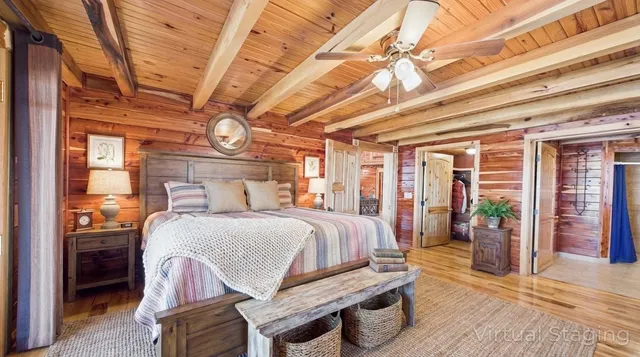 a view of a house with backyard and wooden fence