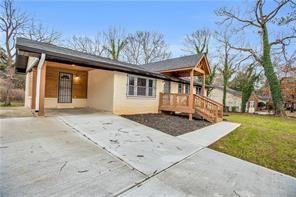 2000 Fairburn Road Southwest Atlanta, GA 30331 - Photo 2 of 24 a front view of a house with a yard