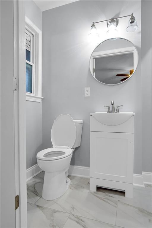 2000 Fairburn Road Southwest Atlanta, GA 30331 - Photo 21 of 24 a bathroom with a sink toilet and a mirror