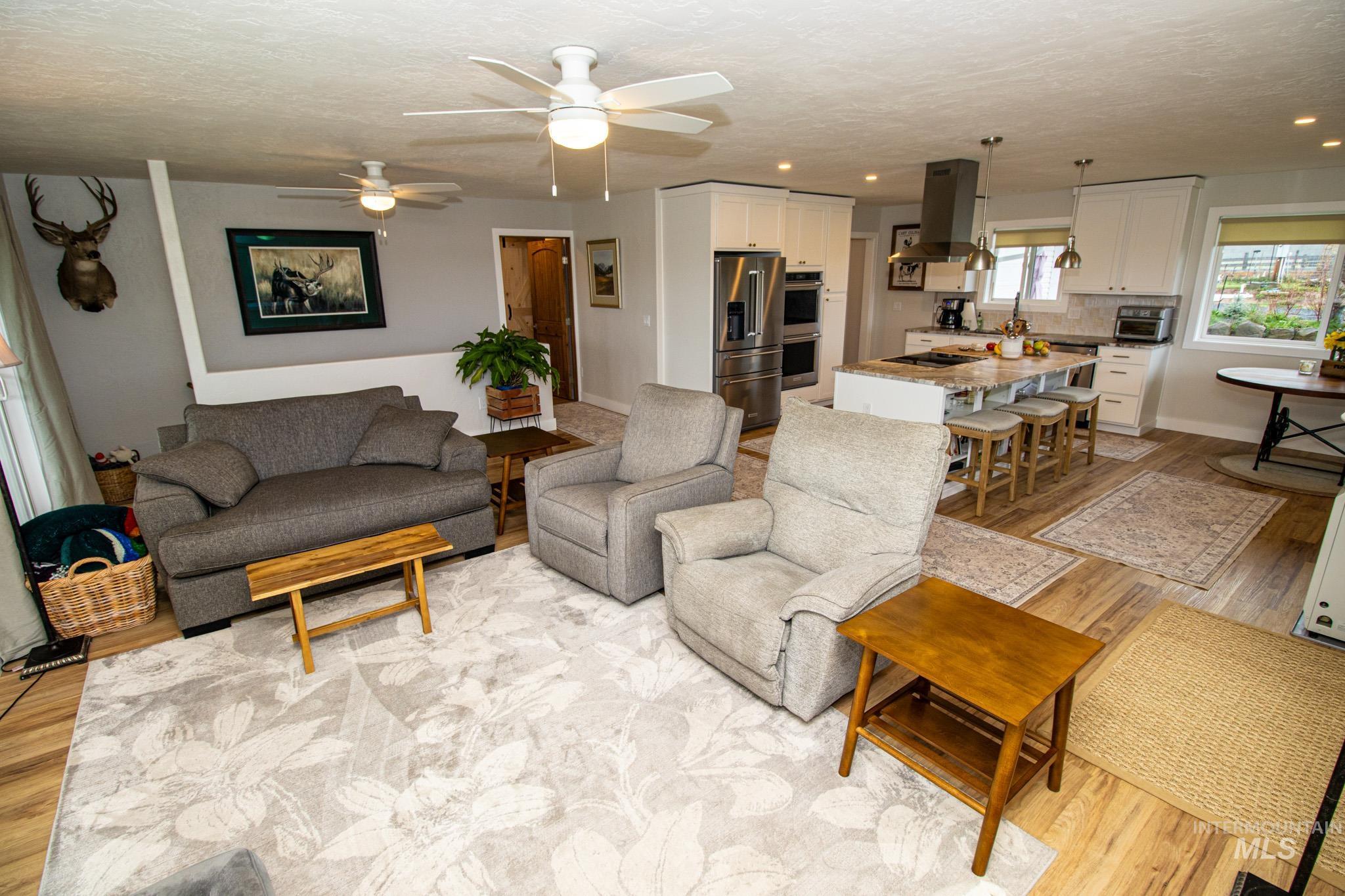 5404 Freeman Creek Road Lenore, ID 83541 - Photo 27 of 50 Living area featuring light wood-style flooring, a ceiling fan, and recessed lighting