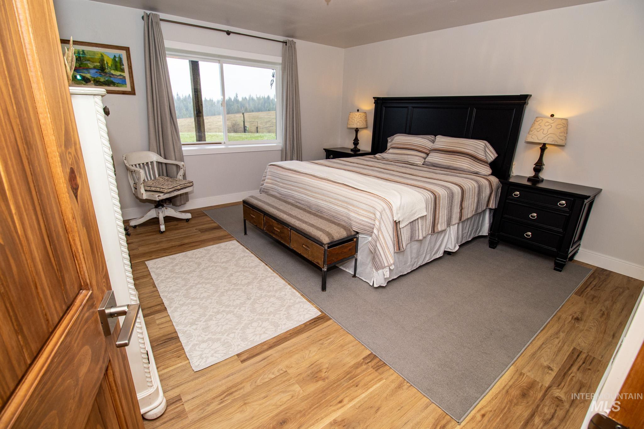 5404 Freeman Creek Road Lenore, ID 83541 - Photo 36 of 50 Bedroom with light wood-style floors