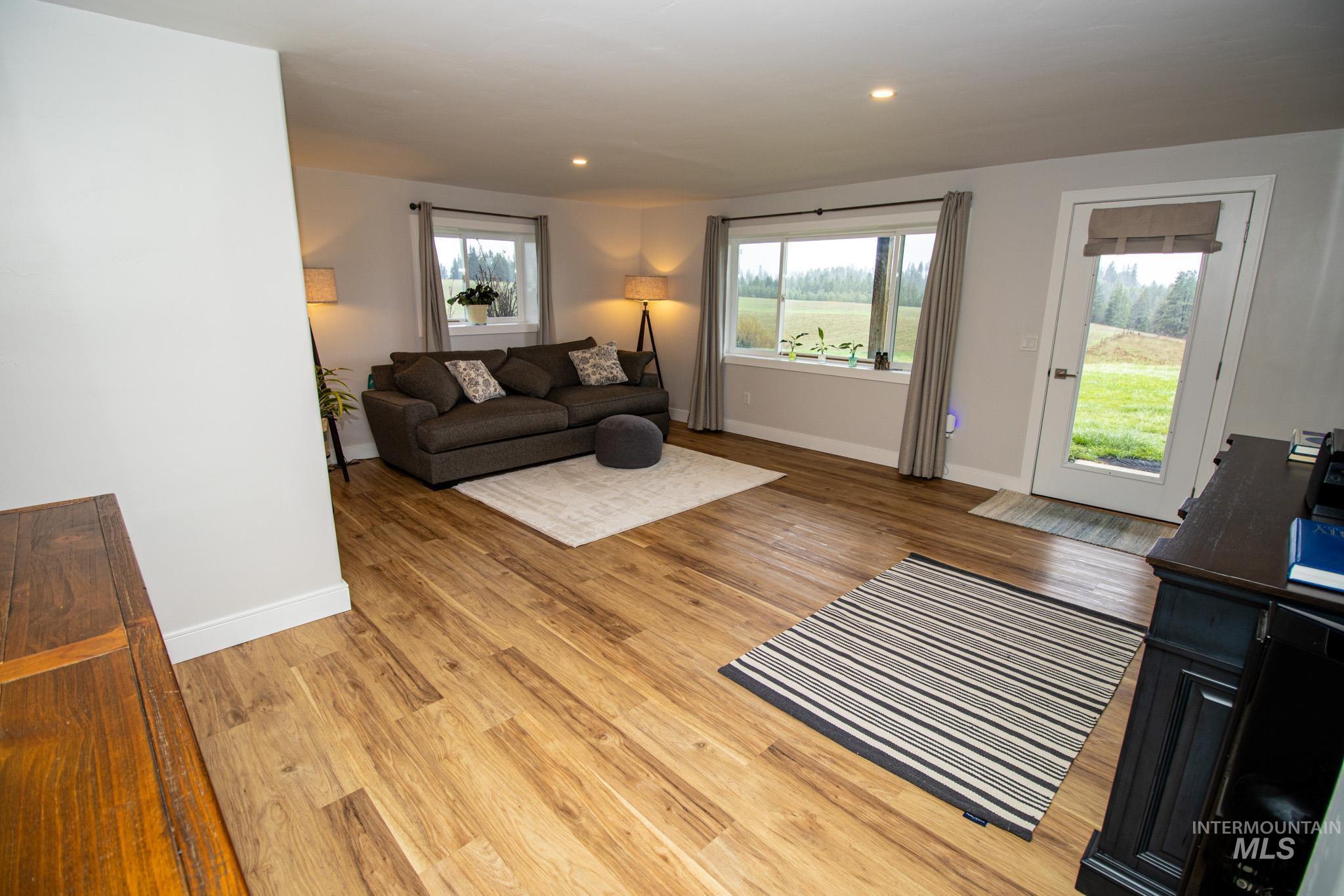 5404 Freeman Creek Road Lenore, ID 83541 - Photo 40 of 50 Living area with light wood-style flooring, plenty of natural light, and recessed lighting