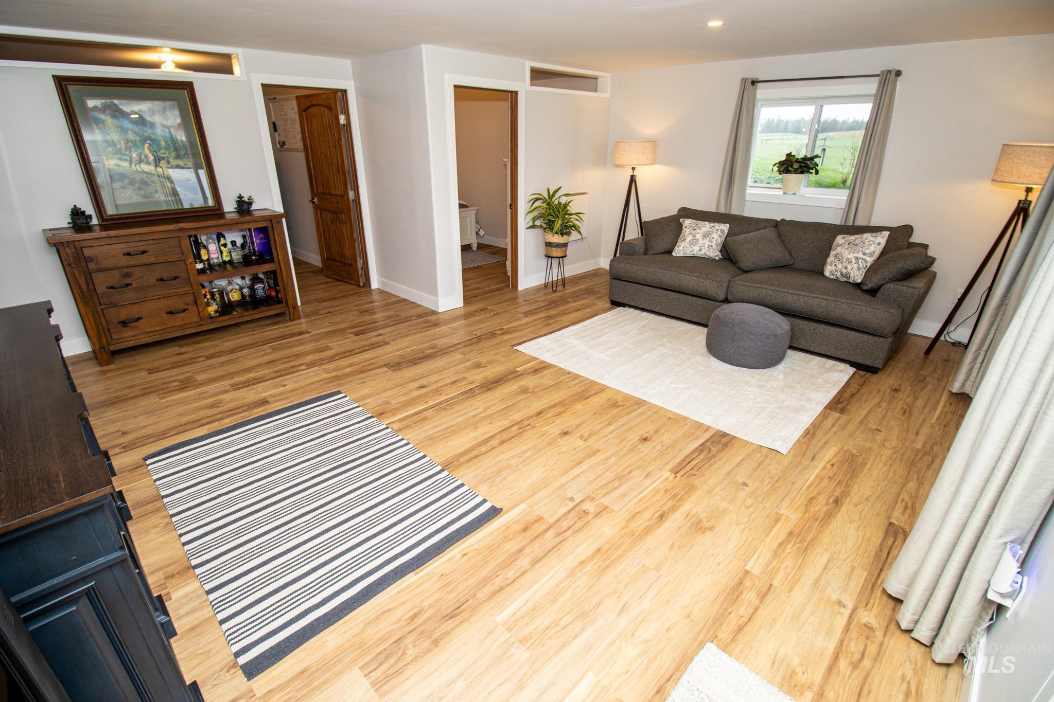 5404 Freeman Creek Road Lenore, ID 83541 - Photo 41 of 50 Living area featuring light wood finished floors and baseboards