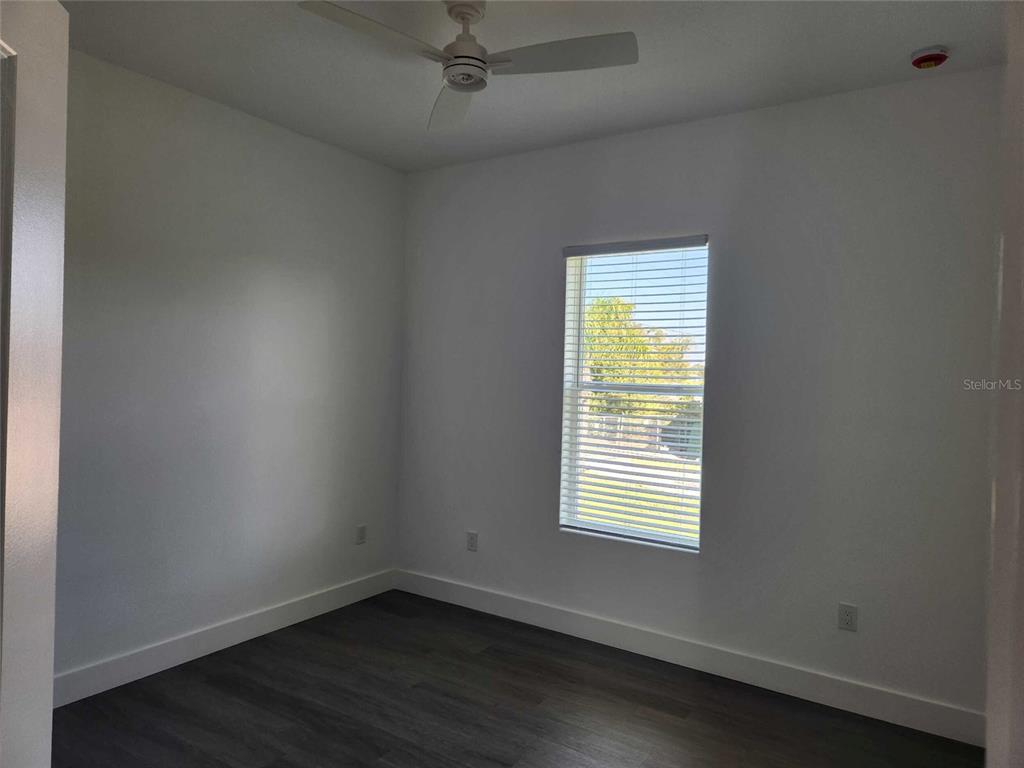 9211 Northcliffe Boulevard Spring Hill, FL 34606 - Photo 17 of 30 an empty room with a window
