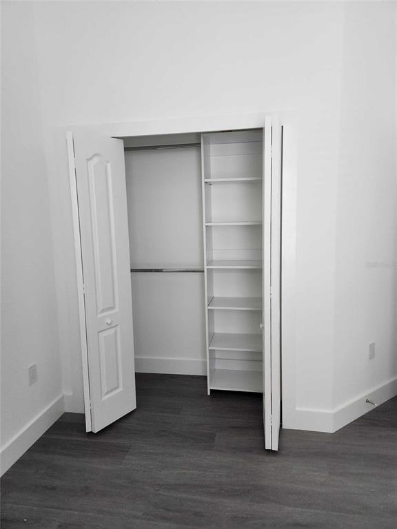 9211 Northcliffe Boulevard Spring Hill, FL 34606 - Photo 21 of 30 a view of walk in closet with empty racks