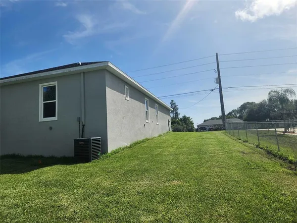 a house view with a backyard space