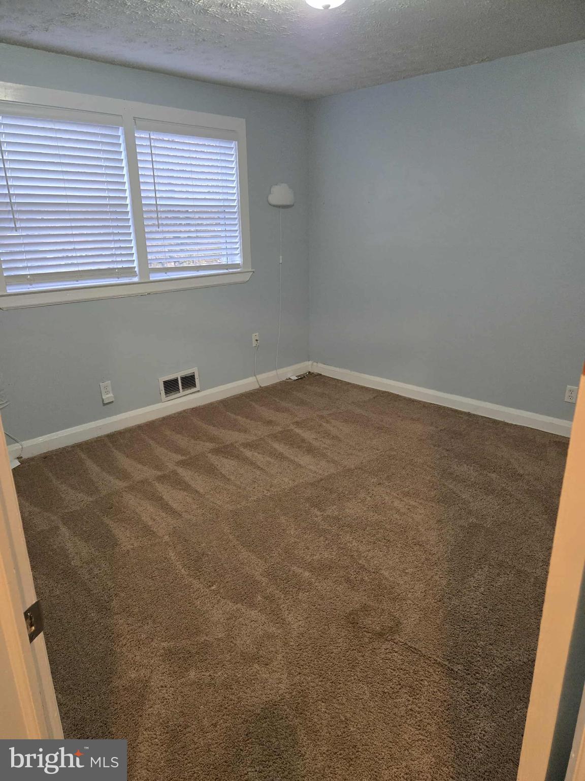 4408 Shamrock Avenue Baltimore, MD 21206 - Photo 17 of 18 an empty room with a window