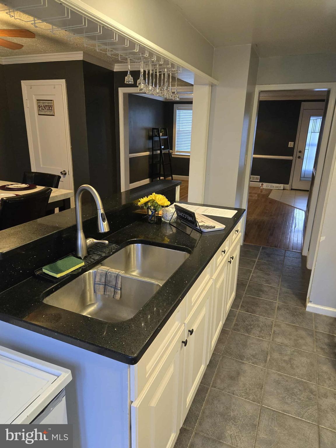 4408 Shamrock Avenue Baltimore, MD 21206 - Photo 2 of 18 a kitchen with granite countertop a sink and a stove