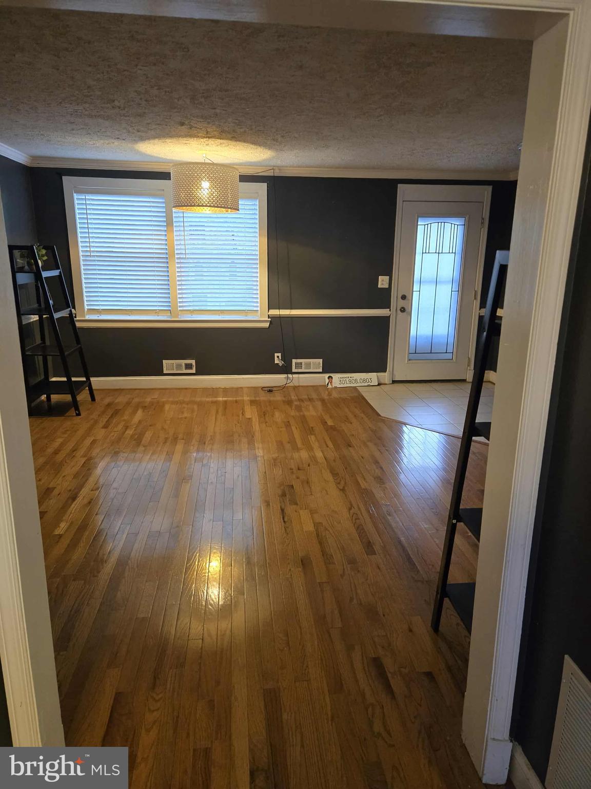 4408 Shamrock Avenue Baltimore, MD 21206 - Photo 8 of 18 a view of a livingroom with wooden floor and window