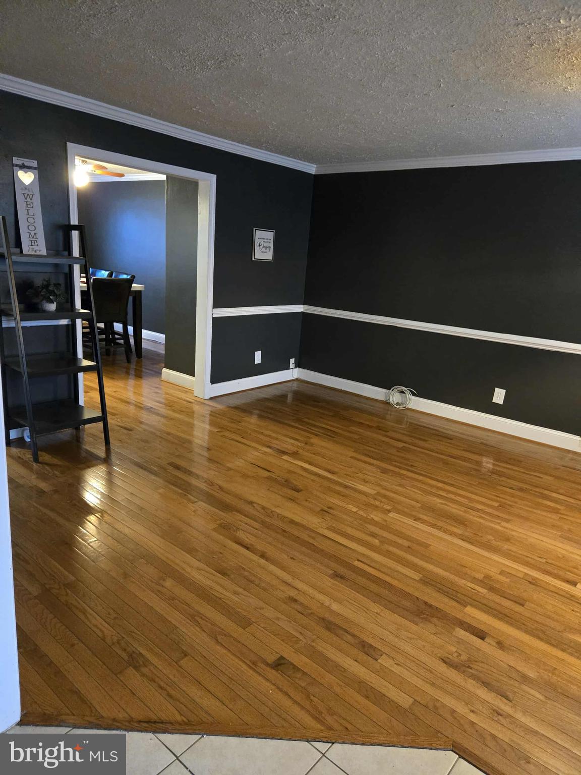 4408 Shamrock Avenue Baltimore, MD 21206 - Photo 9 of 18 a view of kitchen and dining room with wooden floor