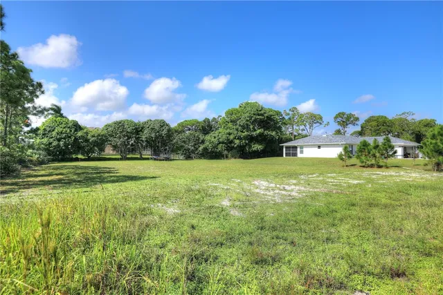 a view of a golf course with a lake