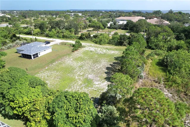 an aerial view of residential house with an outdoor space and balcony