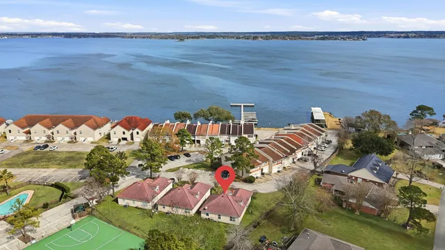 an aerial view of residential houses with outdoor space