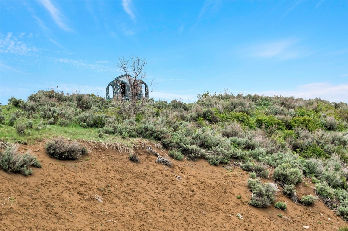 80 County Road 80 Steamboat Springs, CO 80487 - Photo 12 of 43 a backyard of a house with a yard and outdoor seating
