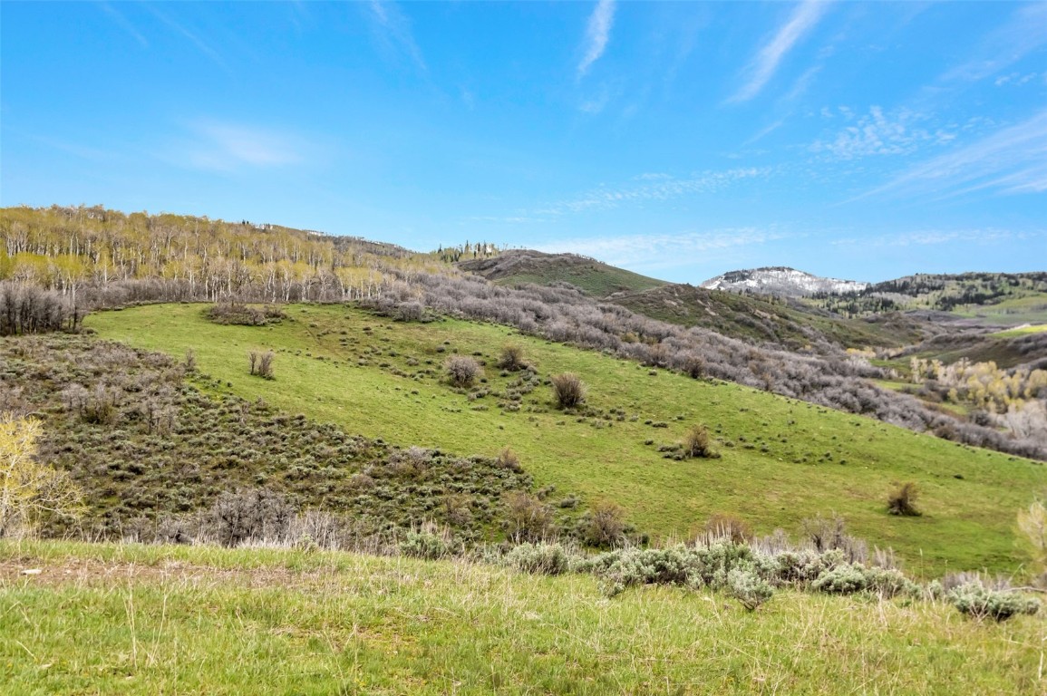 80 County Road 80 Steamboat Springs, CO 80487 - Photo 16 of 43 a view of a lake with mountains in the background
