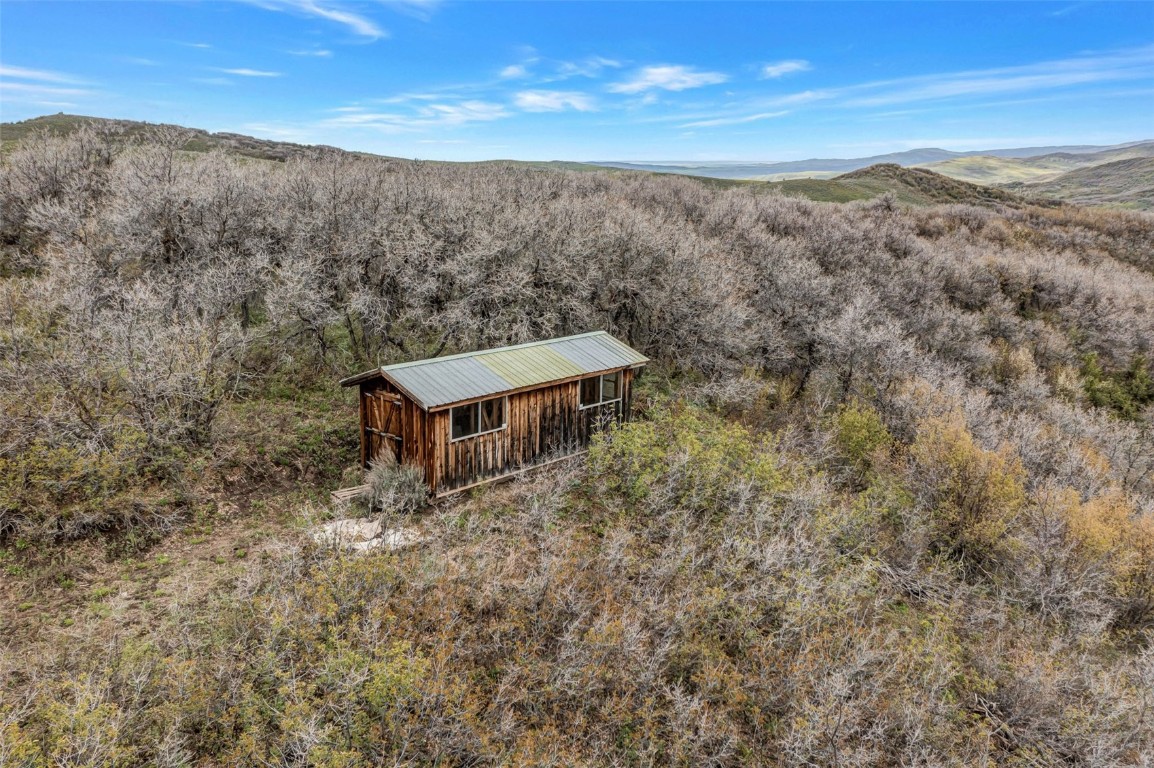 80 County Road 80 Steamboat Springs, CO 80487 - Photo 31 of 43 a view of a field with a mountain in the background
