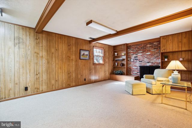 a view of a livingroom with furniture and a fireplace