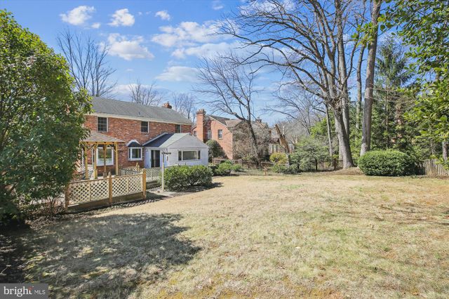 a view of a house with a yard covered in snow