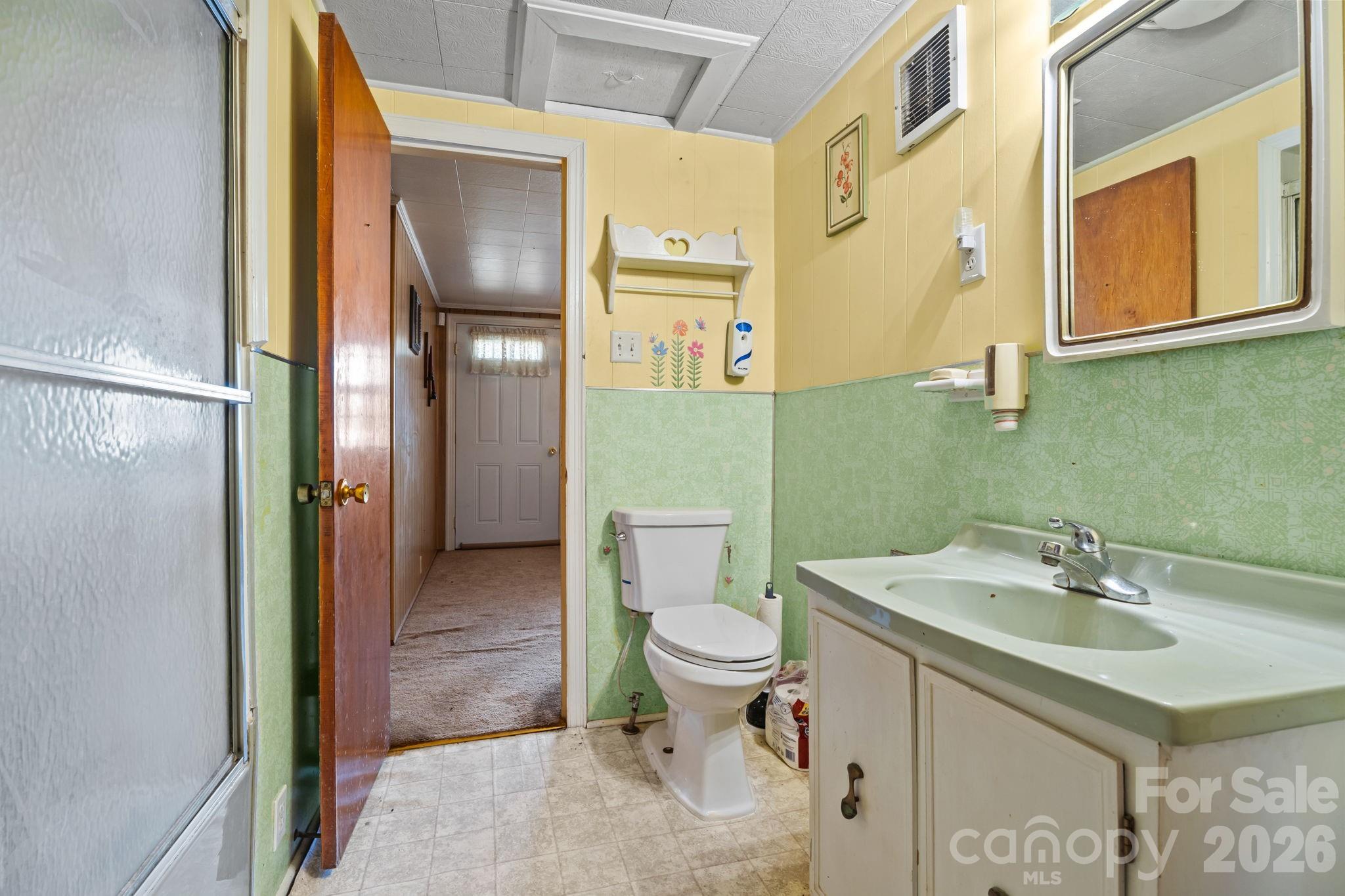 407 Conwell Road Pleasant Hill, NC 27866 - Photo 22 of 31 a bathroom with a sink toilet and shower