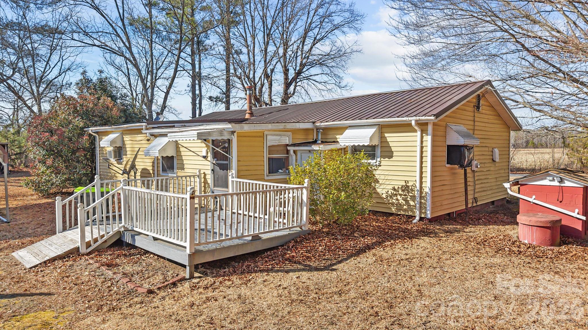 407 Conwell Road Pleasant Hill, NC 27866 - Photo 25 of 31 a view of a house with a yard