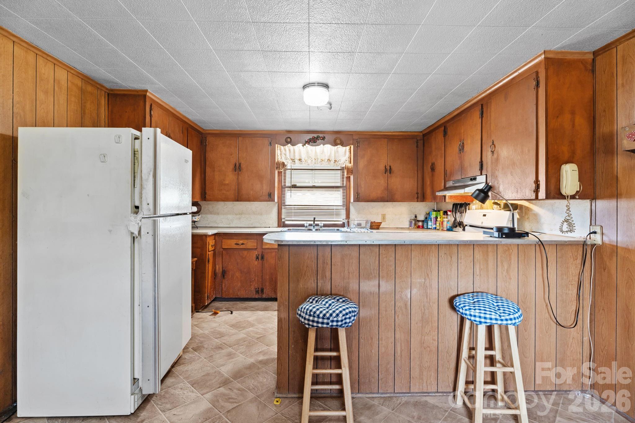 407 Conwell Road Pleasant Hill, NC 27866 - Photo 4 of 31 a kitchen with stainless steel appliances a refrigerator a stove a sink and white cabinets
