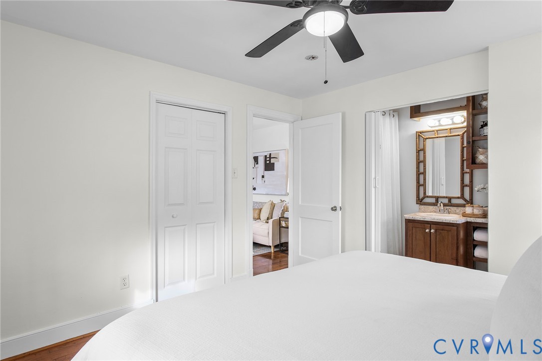 609 Woodstock Road Richmond, VA 23224 - Photo 18 of 33 a bedroom with a bed and wooden floor