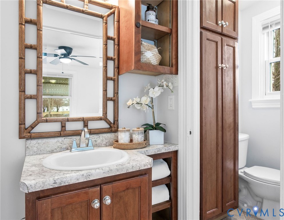 609 Woodstock Road Richmond, VA 23224 - Photo 20 of 33 a bathroom with a granite countertop sink and a mirror