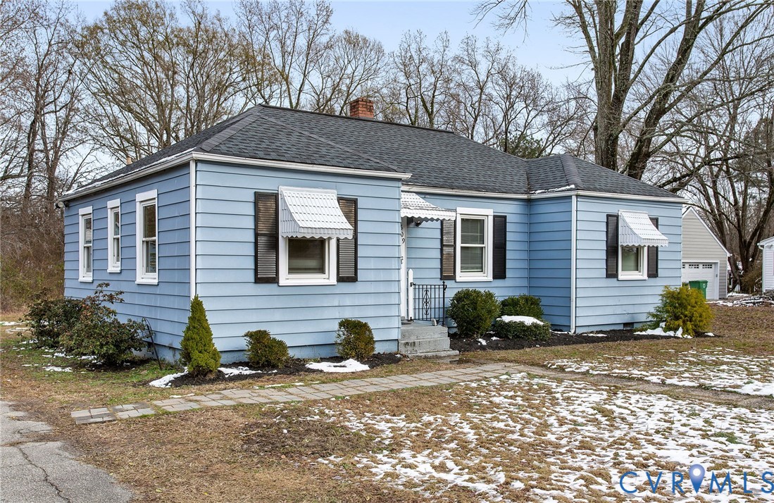 609 Woodstock Road Richmond, VA 23224 - Photo 2 of 33 a front view of a house with a yard