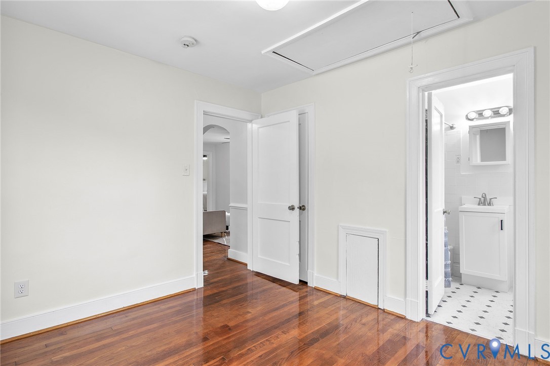 609 Woodstock Road Richmond, VA 23224 - Photo 26 of 33 a view of an empty room with wooden floor