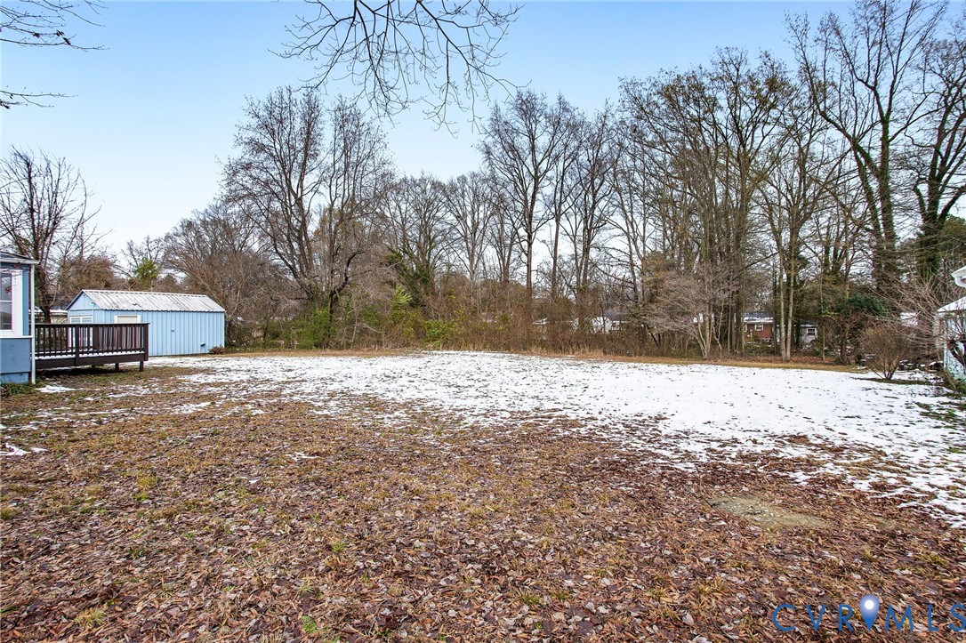 609 Woodstock Road Richmond, VA 23224 - Photo 32 of 33 a view of a yard covered in snow