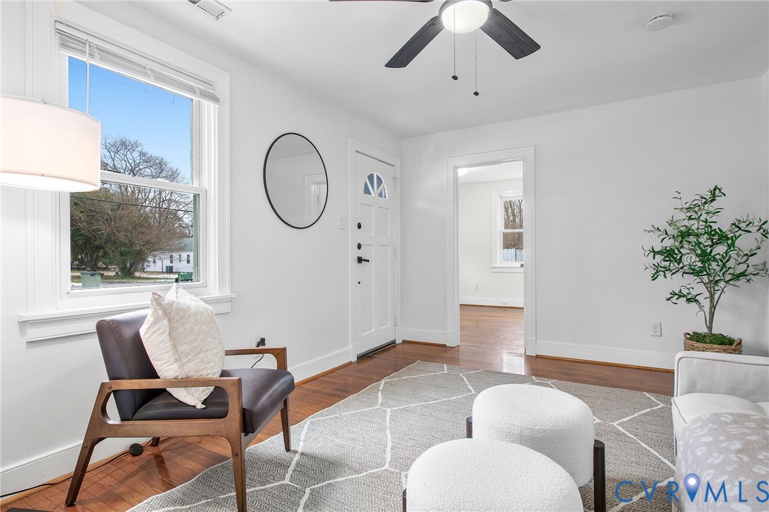 609 Woodstock Road Richmond, VA 23224 - Photo 8 of 33 a living room with furniture a table and a potted plant