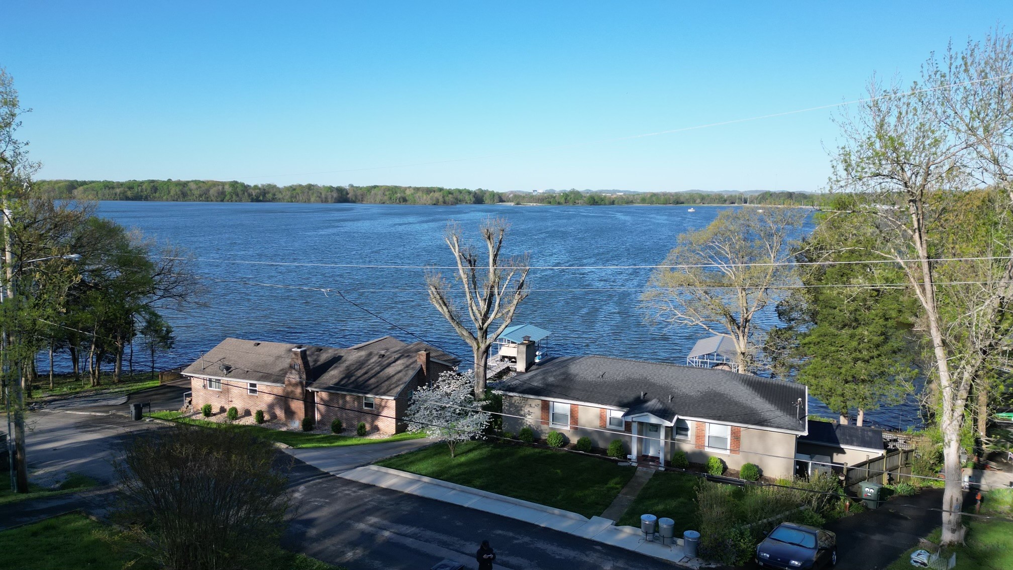 117 Ruby Drive Hendersonville, TN 37075 - Photo 4 of 5 a front view of a house with a yard and lake view