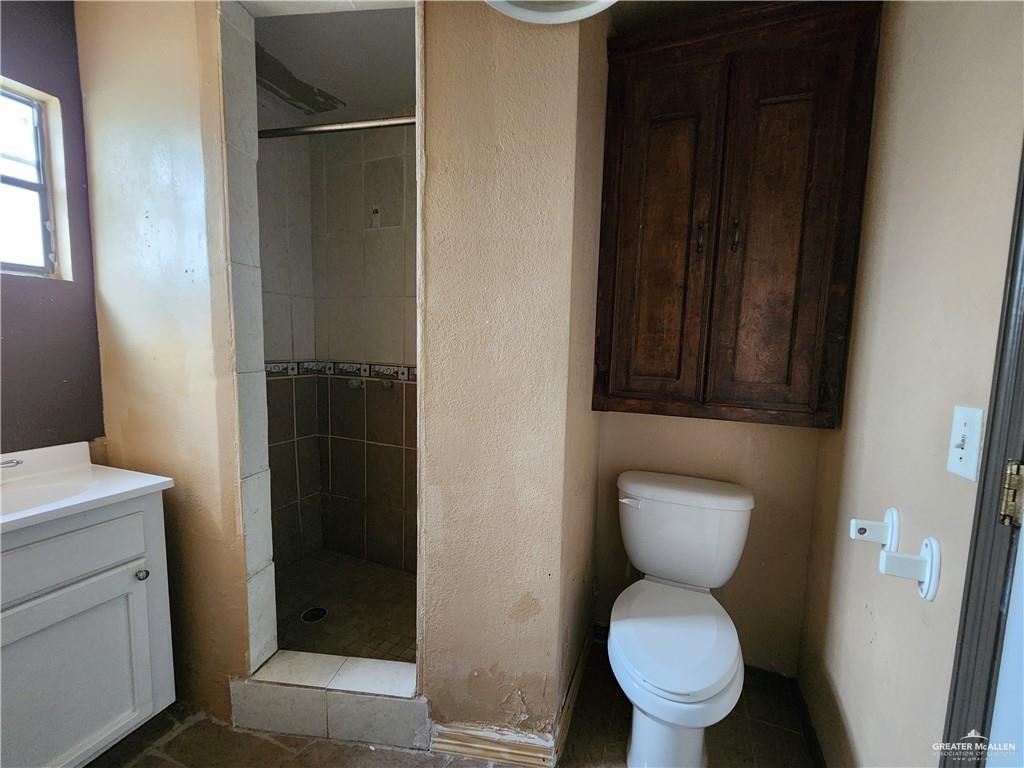 2981 Azalea Street Roma, TX 78584 - Photo 5 of 15 a bathroom with a toilet and a sink