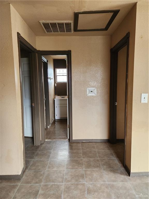 2981 Azalea Street Roma, TX 78584 - Photo 6 of 15 a view of a hallway with wooden shelves