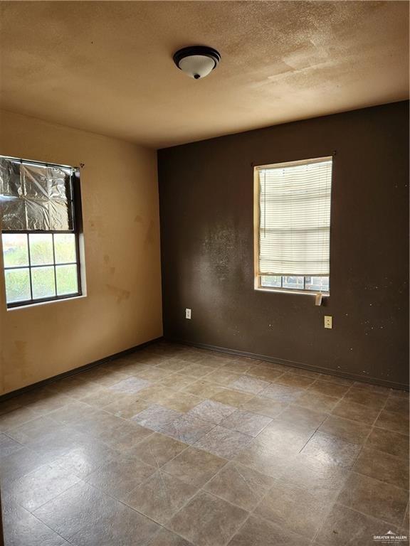 2981 Azalea Street Roma, TX 78584 - Photo 8 of 15 an empty room with windows
