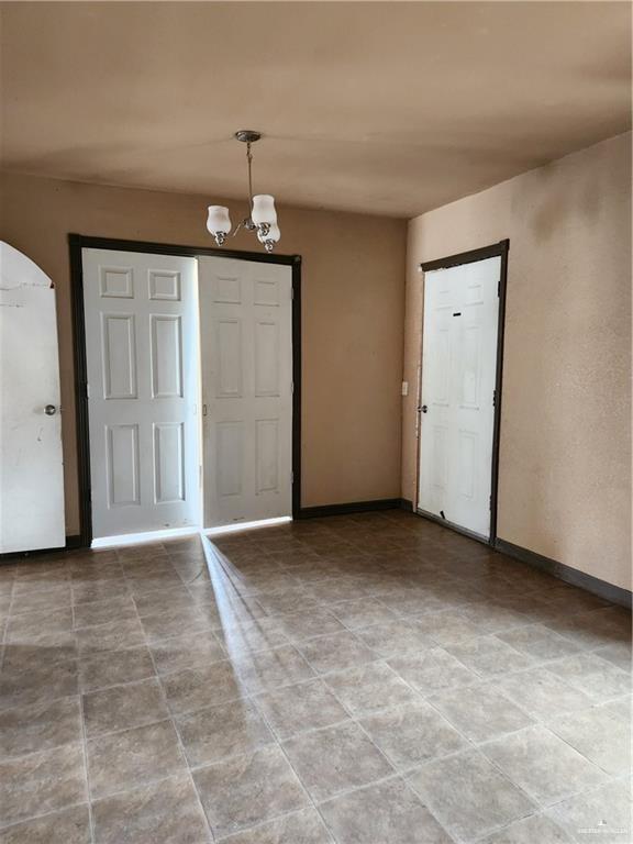 2981 Azalea Street Roma, TX 78584 - Photo 9 of 15 an empty room with closet and windows