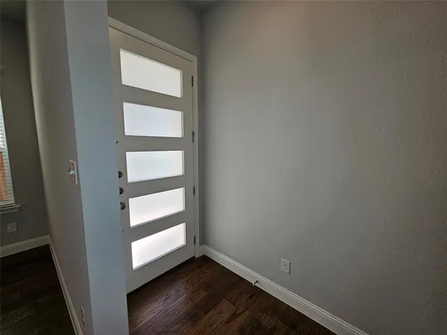 a view of an empty room and window