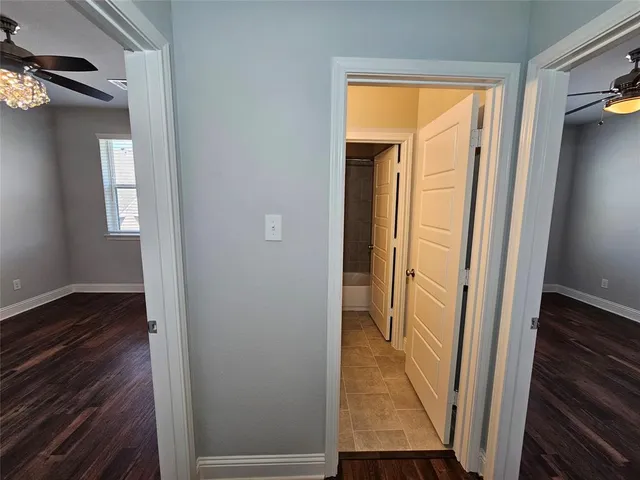 a view of a bathroom from a hallway