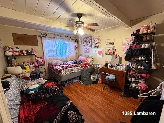 a bed room with a bed and a tv