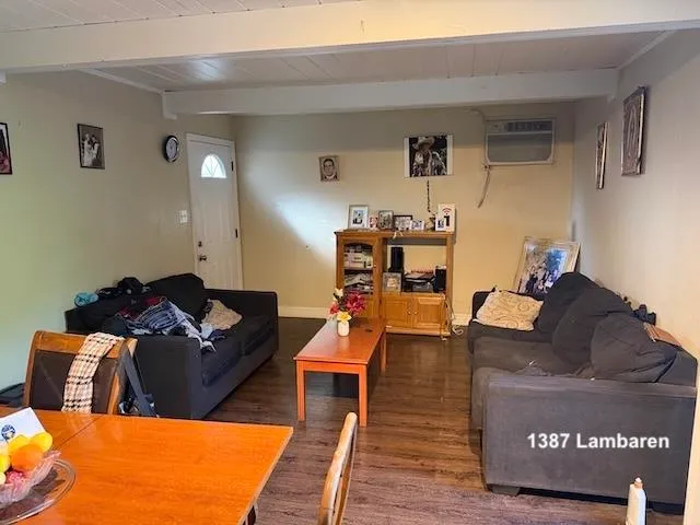 a room with furniture a chandelier and a window