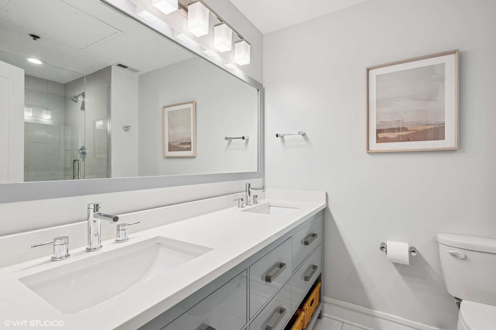 212 West Washington Street, Unit 1807 Chicago, IL 60606 - Photo 11 of 24 a bathroom with a sink a toilet and a mirror