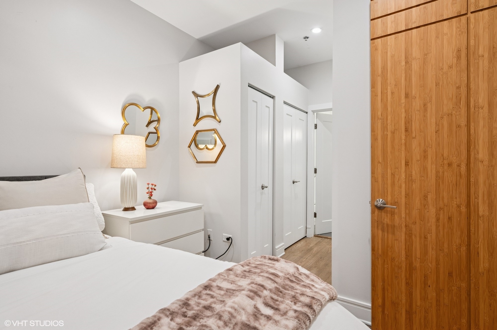 212 West Washington Street, Unit 1807 Chicago, IL 60606 - Photo 12 of 24 a bedroom with a bed and a cabinets