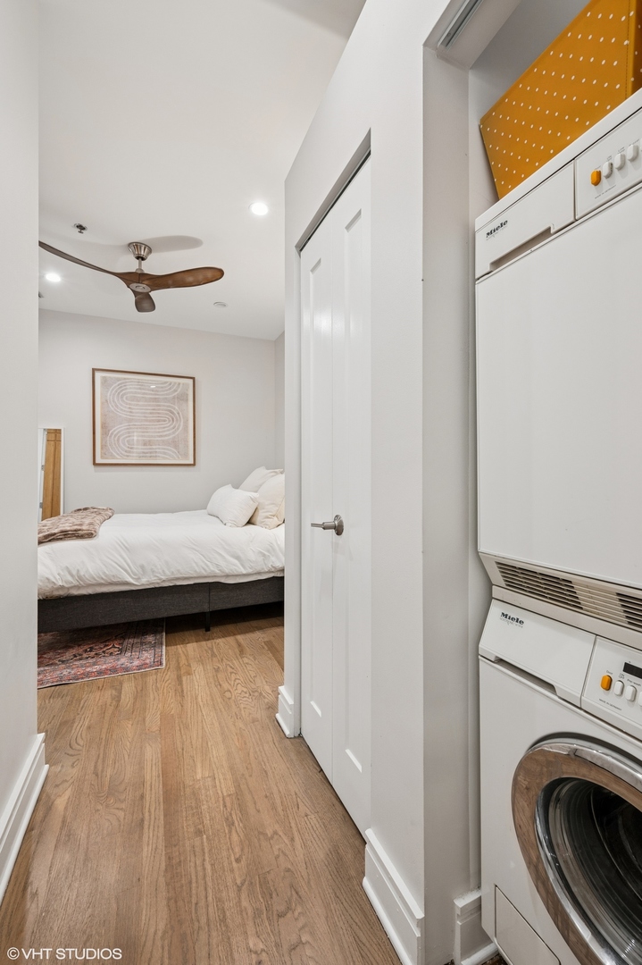 212 West Washington Street, Unit 1807 Chicago, IL 60606 - Photo 13 of 24 a bedroom with a bed and a couch