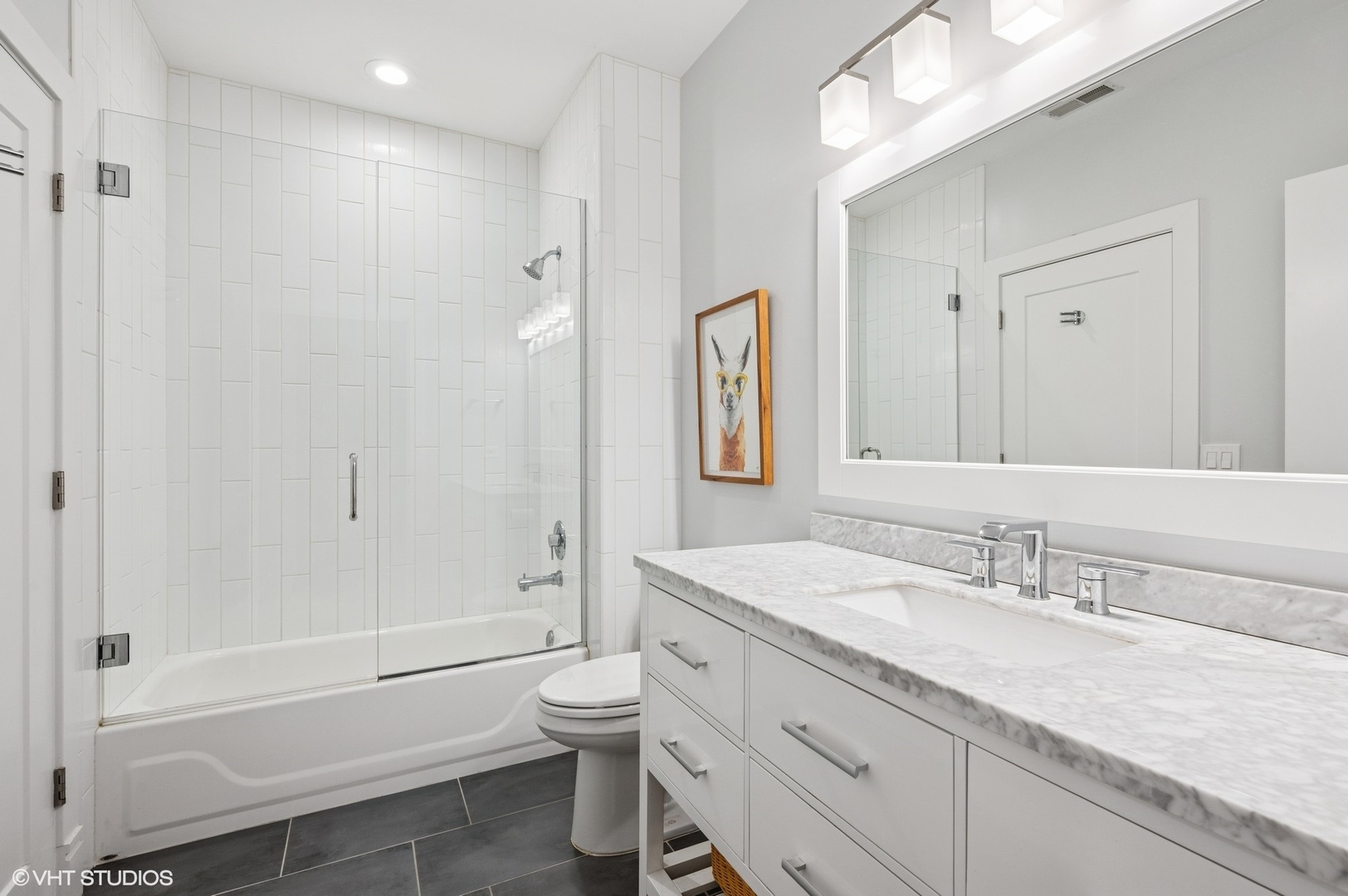 212 West Washington Street, Unit 1807 Chicago, IL 60606 - Photo 14 of 24 a bathroom with a granite countertop sink a toilet and shower