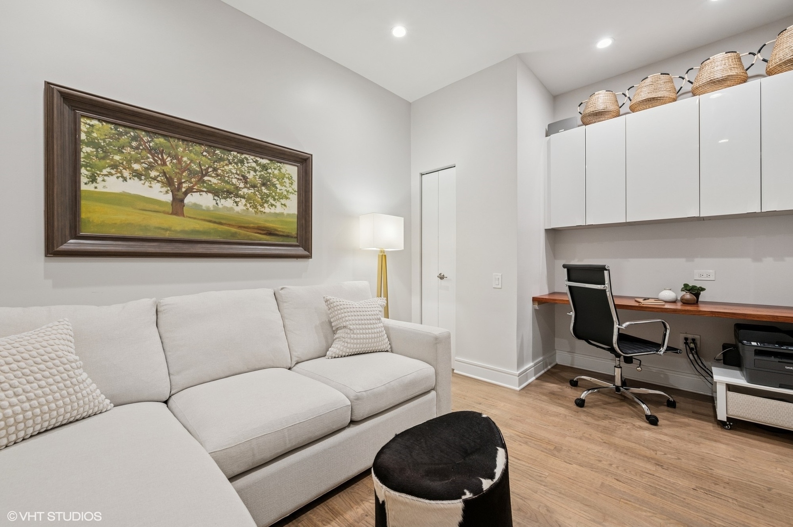 212 West Washington Street, Unit 1807 Chicago, IL 60606 - Photo 15 of 24 a living room with furniture and a wooden floor