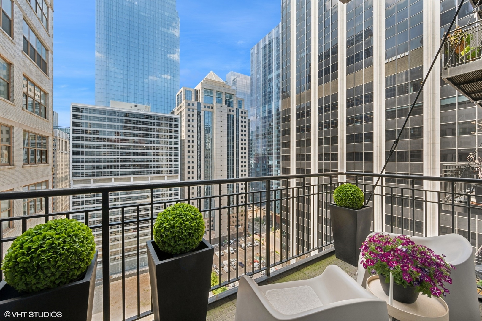 212 West Washington Street, Unit 1807 Chicago, IL 60606 - Photo 18 of 24 a view of a balcony with a potted plant