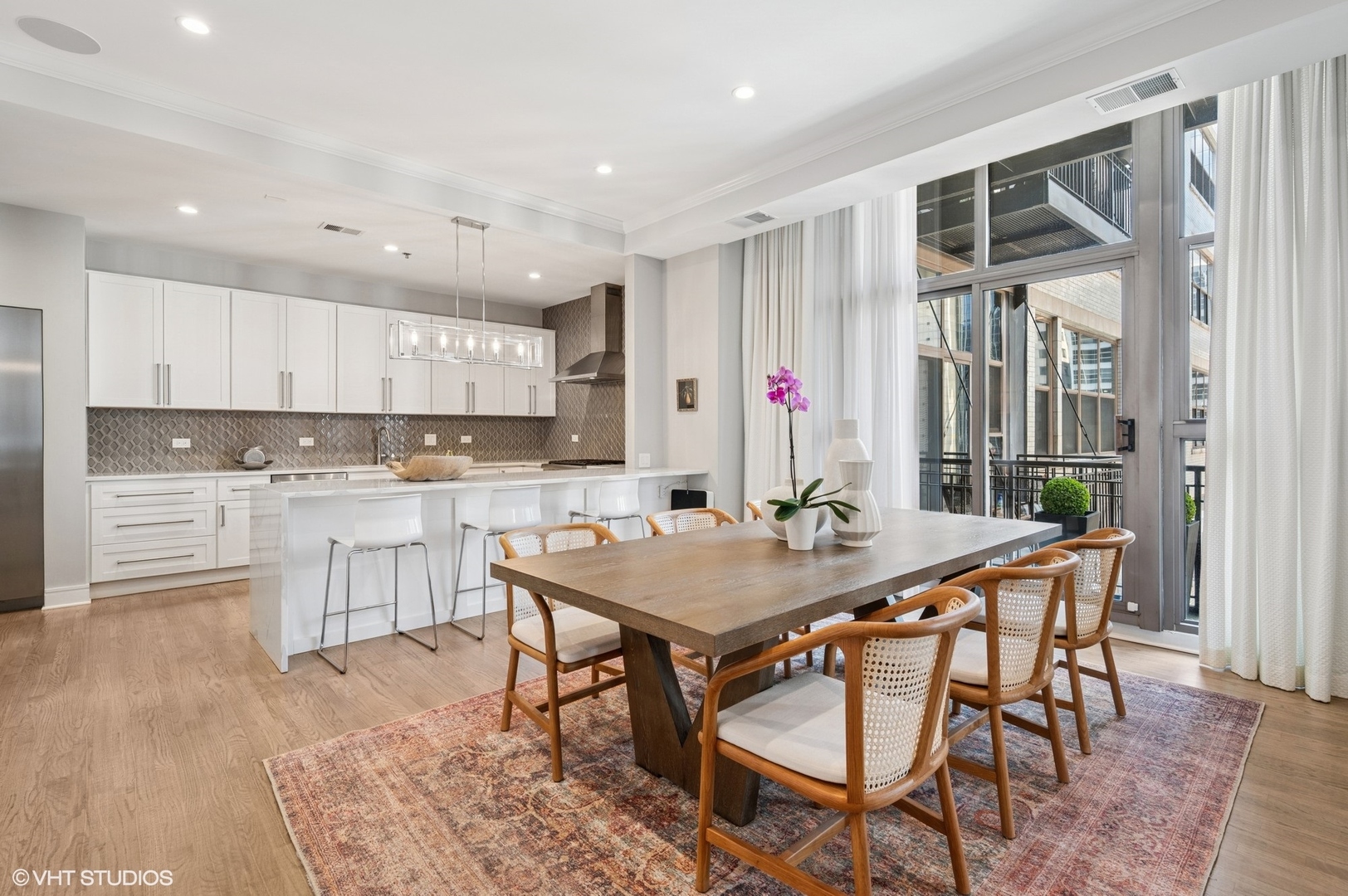 212 West Washington Street, Unit 1807 Chicago, IL 60606 - Photo 2 of 24 a view of a dining room with furniture and wooden floor