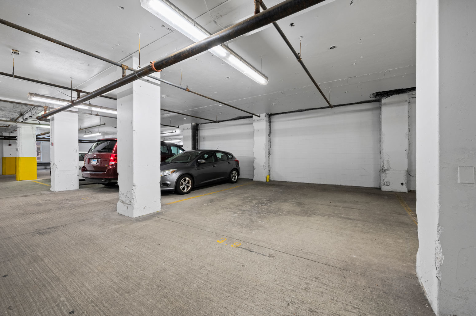 212 West Washington Street, Unit 1807 Chicago, IL 60606 - Photo 23 of 24 a view of parking garage with cars