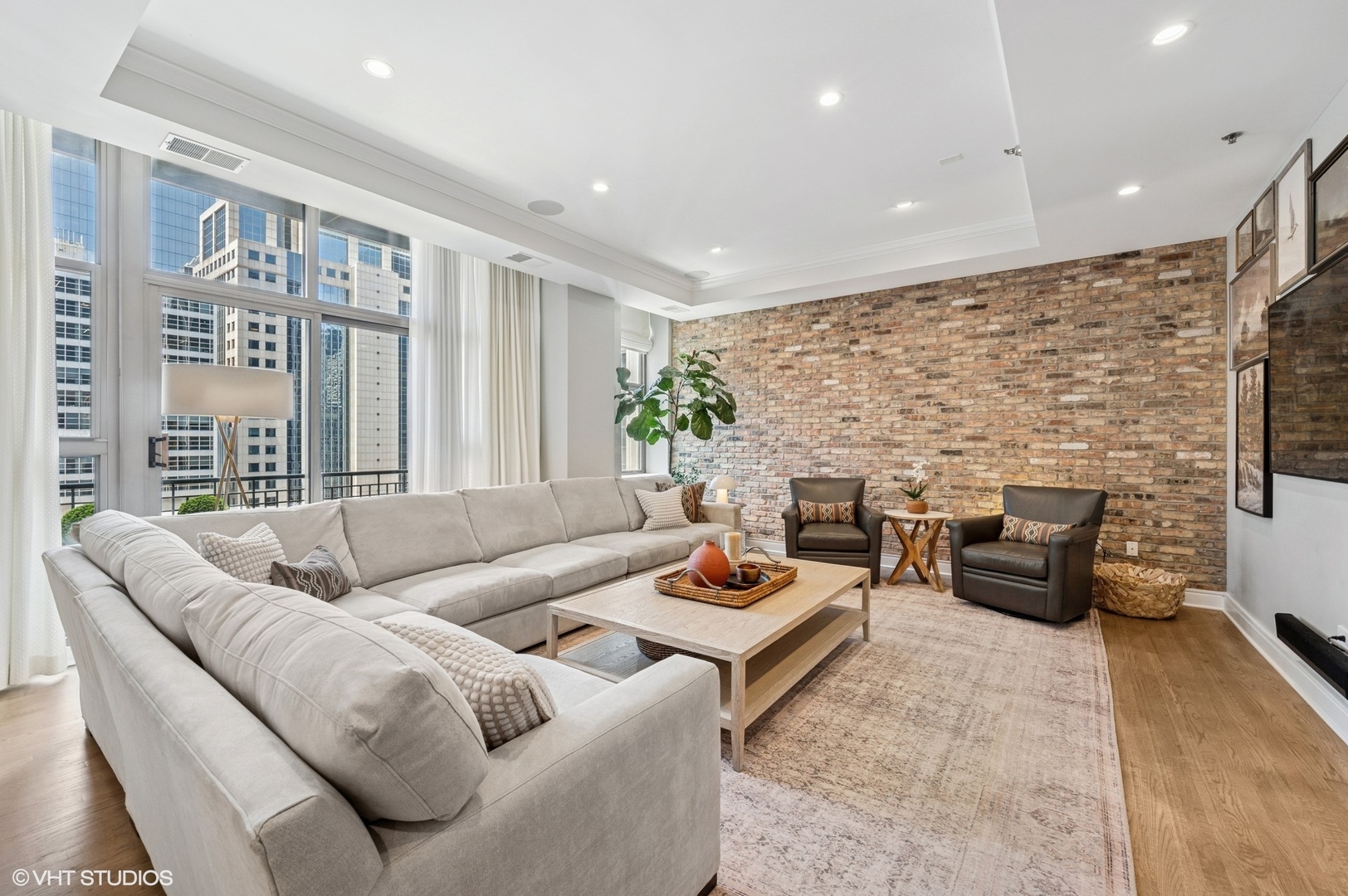 212 West Washington Street, Unit 1807 Chicago, IL 60606 - Photo 6 of 24 a living room with furniture and a fireplace