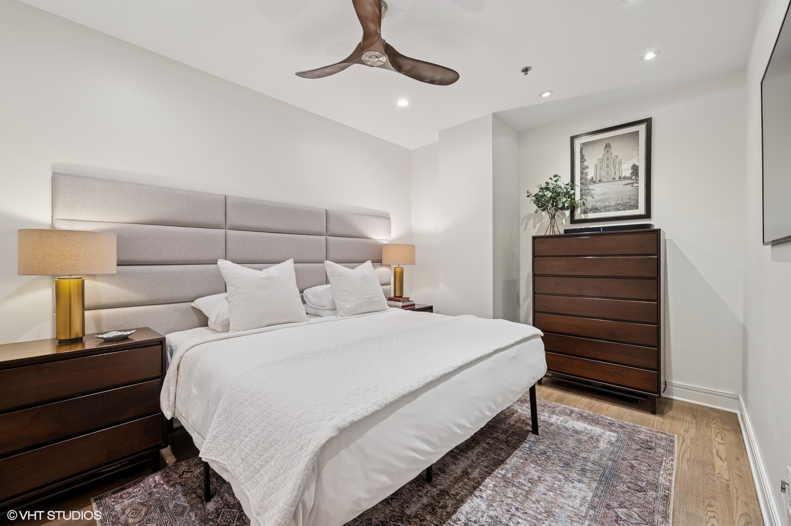 212 West Washington Street, Unit 1807 Chicago, IL 60606 - Photo 10 of 24 a bedroom with a bed and cabinet